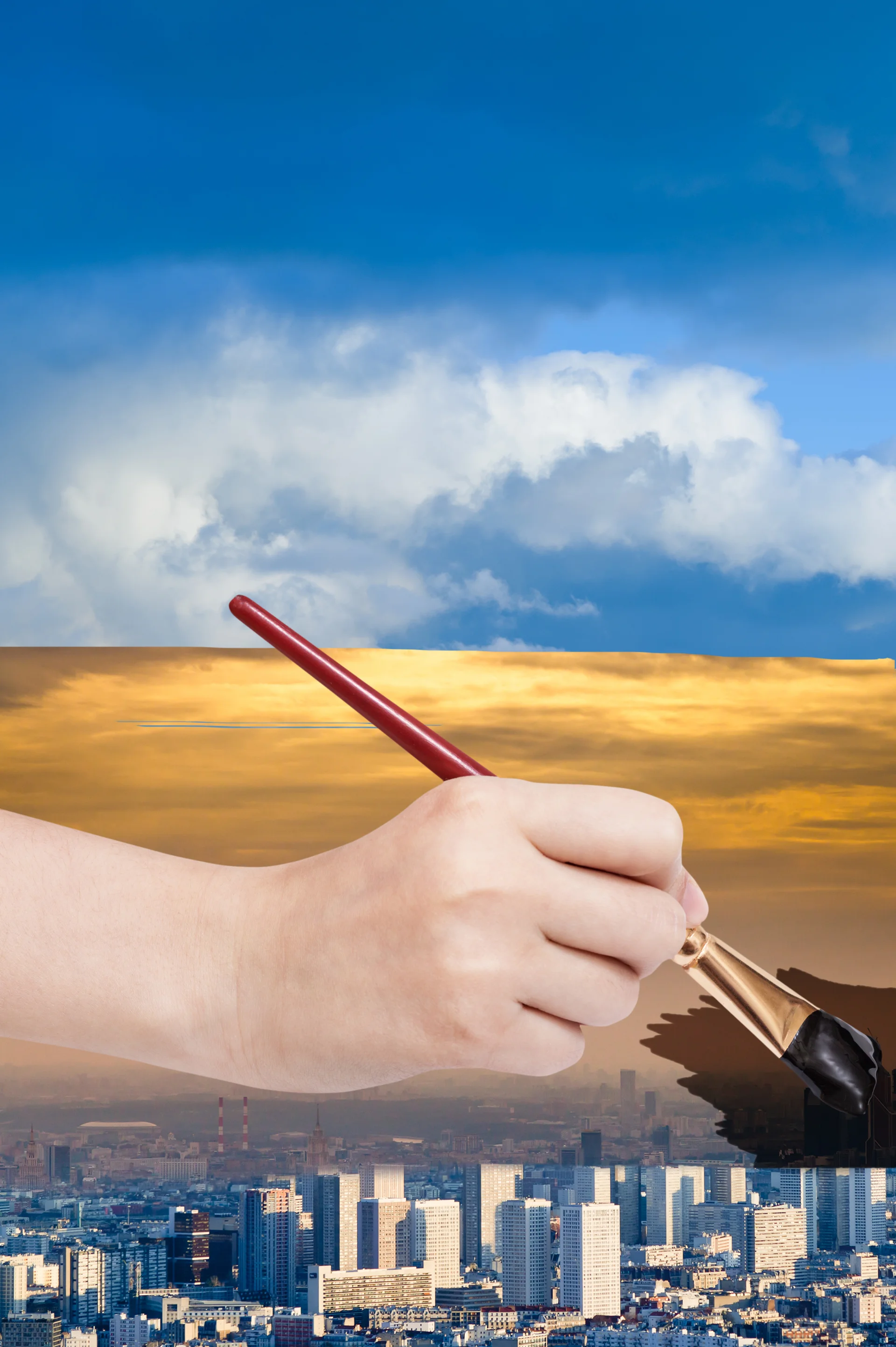 Paintbrush paints smog sky over blue city