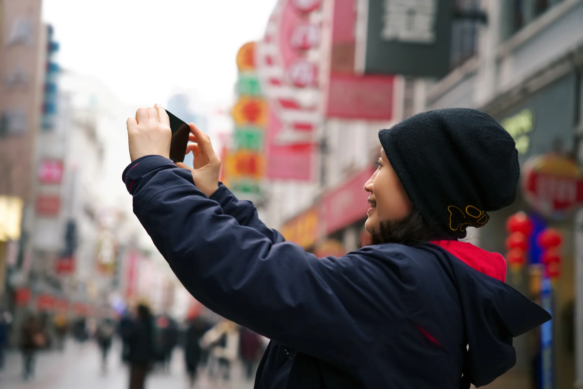 Tourist Capturing Memories on City Streets