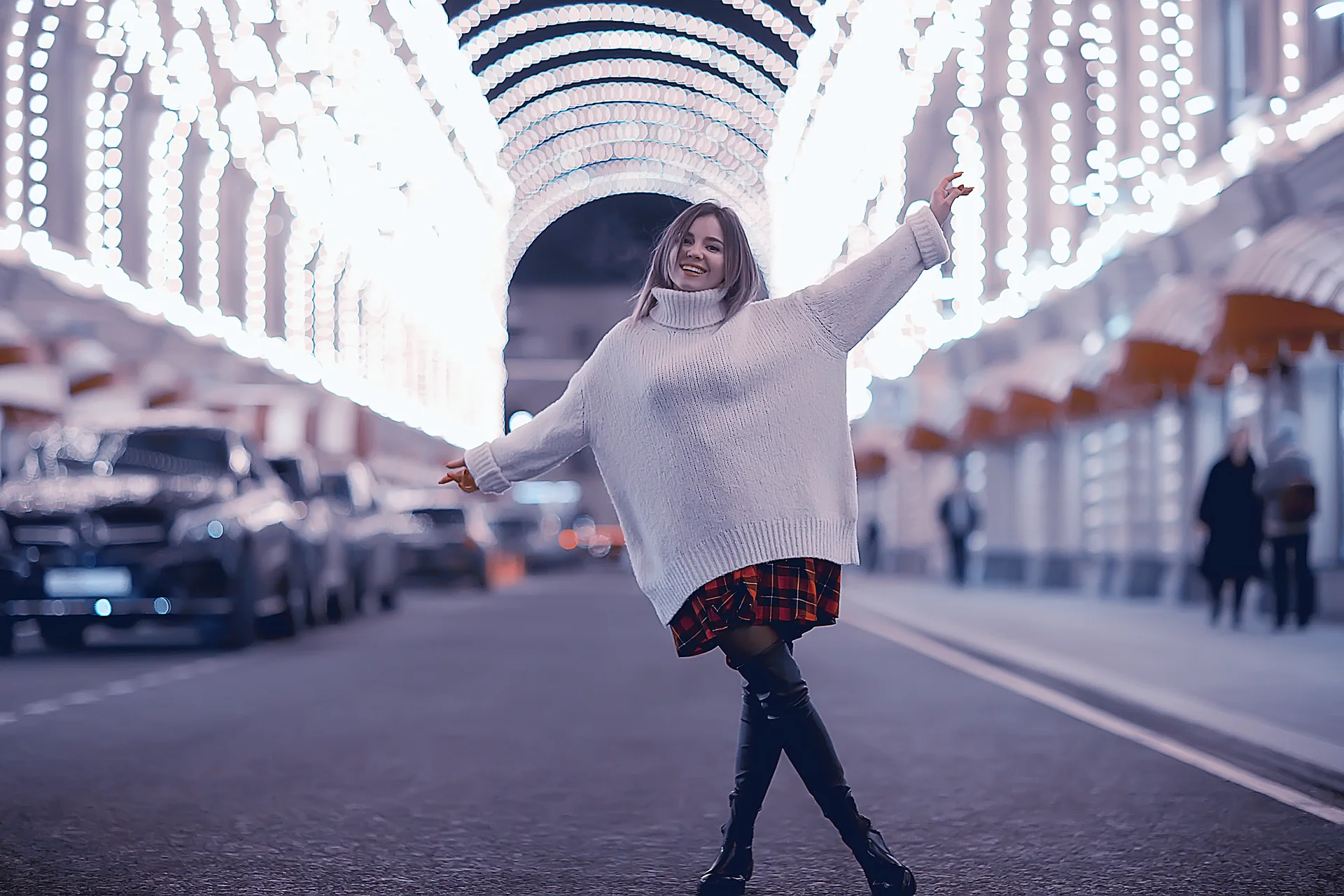portrait of a woman white sweater winter, seasonal outside city walk in the evening city
