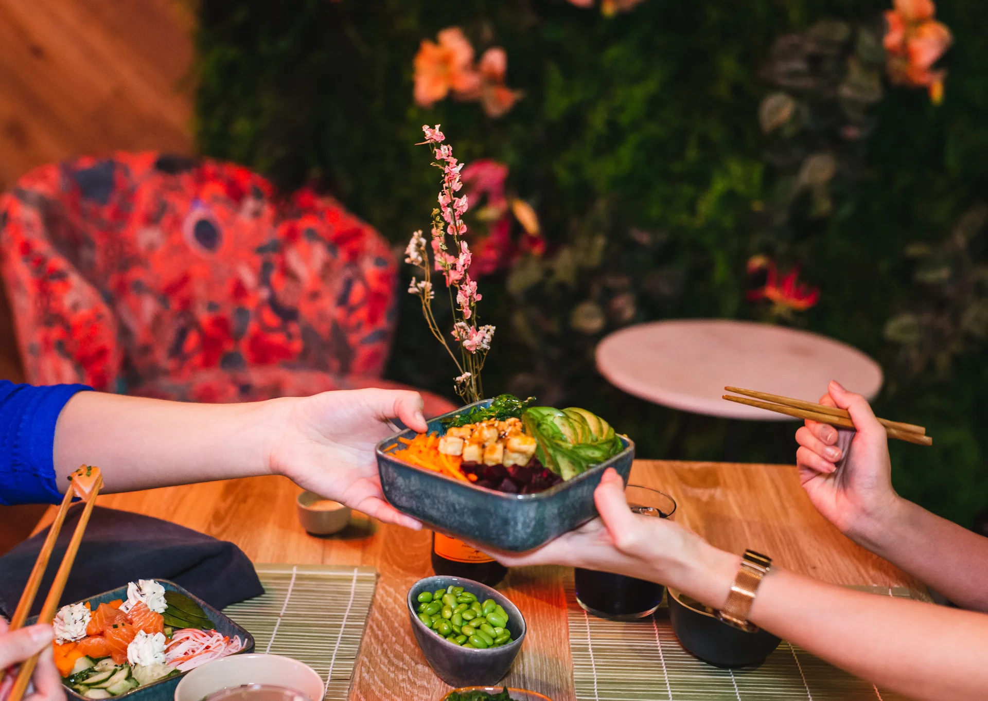 Midsection of woman holding food on table
