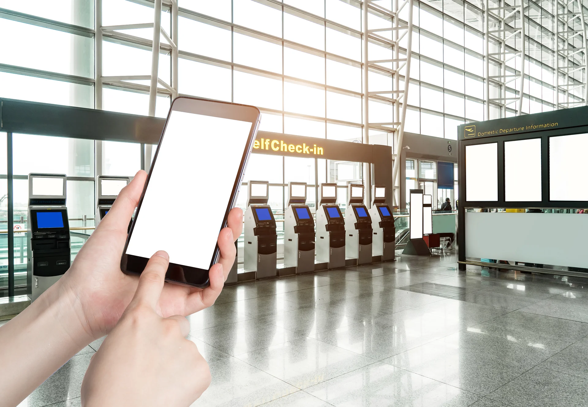 Man using smart phone mobile in the airport terminal